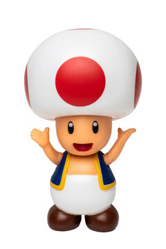 Supermario Bros character Toad,  a humanoid mushroom-like character figurine on white background