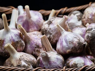  Close up of a basket of garlic.