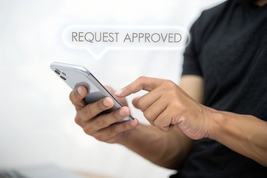 Person using smartphone with approved request notification