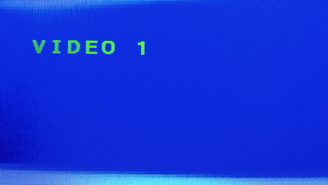 CRT television displaying the "VIDEO 1" input on blue background. No signal screen. Nostalgia of retro vhs technology. Feeling from the past.