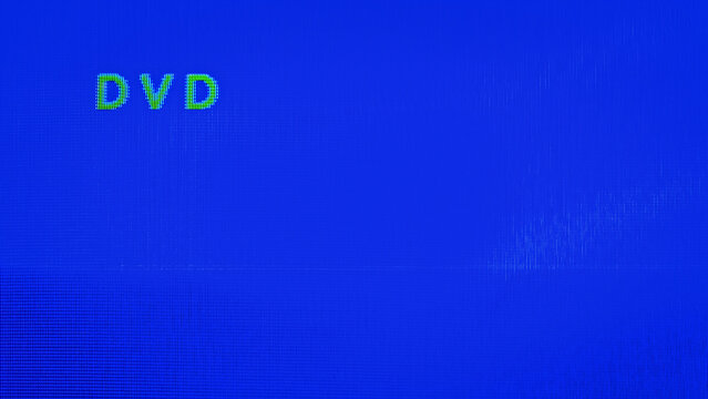 CRT tv displaying the "DVD" input on blue background. Screen no signal, Disconnected or powered-off DVD player. Retro vhs technology and nostalgia.