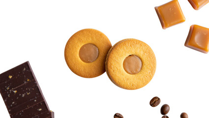 Two oval shaped biscuits with a filling and a piece of dark chocolate isolated on transparent background