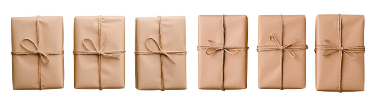 Six neatly wrapped brown paper packages tied with twine, arranged in row, evoking rustic and minimalistic aesthetic