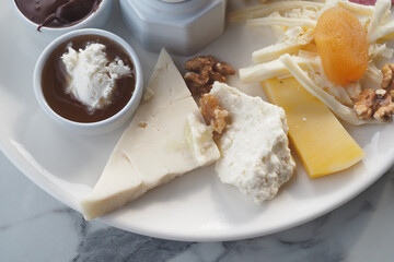 Indulging in a gourmet cheese platter with accompaniments