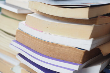Books stacked on a table in a cozy reading nook