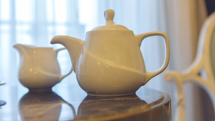  Cozy Hotel Room with Tea Service – Woman Enjoying The Moment,Woman Drinking Tea in Comfortable Hotel Room – Relaxing Hospitality Scene