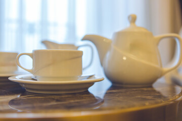  Cozy Hotel Room with Tea Service – Woman Enjoying The Moment,Woman Drinking Tea in Comfortable Hotel Room – Relaxing Hospitality Scene