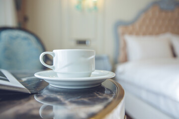 Cozy Hotel Room with Tea Service – Woman Enjoying The Moment,Woman Drinking Tea in Comfortable Hotel Room – Relaxing Hospitality Scene