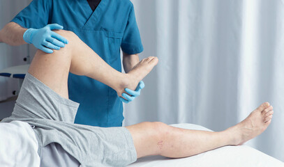  Modern Physiotherapy Clinic with Medical Team – Therapist Assisting Patient and Doctor...