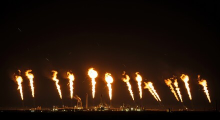 Industrial Night Spectacle: Fiery Jets Against a Dark Sky