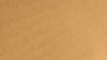 Brown color paper shown grain details on  it surface. texture hard paper sheet. Beige recycled eco carton paper.