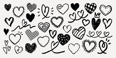 A collection of hand-drawn hearts in various styles. Black and white hearts, sketched hearts, and doodle hearts create a playful, artistic pattern. Hand drawn Valentine's Day vector set. © Rawpixel.com