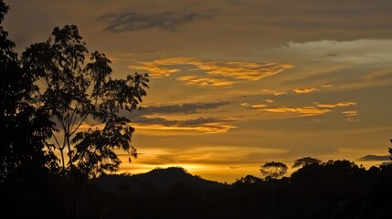 Dramatic sunrise and sunset sky with vibrant clouds, showcasing warm and cool color contrasts in a panoramic view.