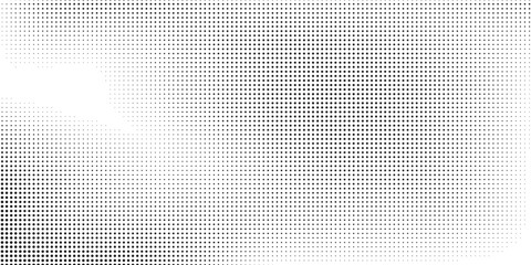 Grunge dotted halftone gradient texture. Vanishing polka dot abstract