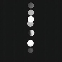 Vertical column of light circles on dark background