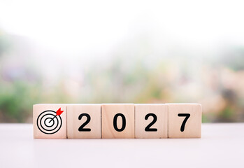Wooden blocks with the number 2027 with nature background. The concept of Goal achievement , target, strategy and success in 2027
