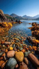 Clear water, colorful stones, and mountains