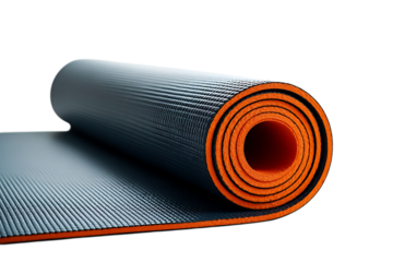 Partially Unrolled Black and Orange Yoga Mat with Textured Surface on a Dark Background