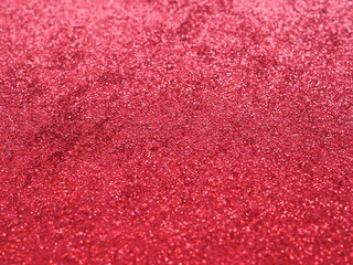 Bright red background reflects glittering light. Close up, concept for celebration, positive emotion, text, design and banner