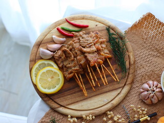 Moo Ping (Thai grilled pork skewers) — a beloved Thai street food made from marinated pork...