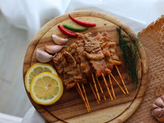 Moo Ping (Thai grilled pork skewers) — a beloved Thai street food made from marinated pork...