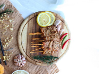 Moo Ping (Thai grilled pork skewers) — a beloved Thai street food made from marinated pork...