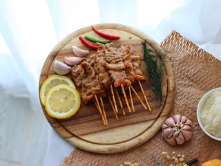 Moo Ping (Thai grilled pork skewers) — a beloved Thai street food made from marinated pork...