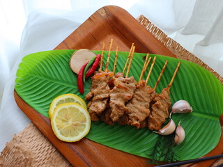 Moo Ping (Thai grilled pork skewers) — a beloved Thai street food made from marinated pork...