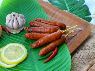 Grilled sausage — a popular street food in Thailand and many cultures worldwide. Juicy and smoky, these sausages are cooked over charcoal or an open flame until golden brown. Often served with sticky 