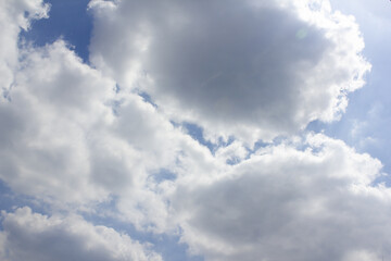 Blue sky with puffy clouds