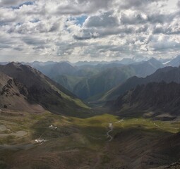 Green valley and high mountains landscape