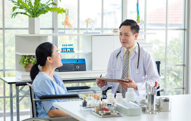 Fototapeta premium Asian male doctor in white coat with stethoscope, consulting explain medications to senior female patient professional support trust healthcare checkup, insurance treatment wellness in hospital clinic