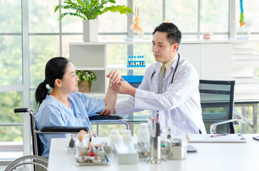 Asian male doctor in white coat with stethoscope, consulting explain medications to senior female patient professional support trust healthcare checkup, insurance treatment wellness in hospital clinic