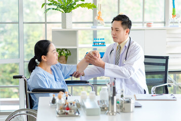 Fototapeta premium Asian male doctor in white coat with stethoscope, consulting explain medications to senior female patient professional support trust healthcare checkup, insurance treatment wellness in hospital clinic