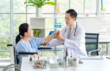 Fototapeta premium Asian male doctor in white coat with stethoscope, consulting explain medications to senior female patient professional support trust healthcare checkup, insurance treatment wellness in hospital clinic