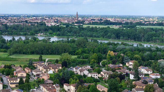 Breathtaking Po Valley Landscape with Vibrant Cultivated Fields Farmhouses and Distant Cremona Skyline Near Castelvetro Piacentino Italy Scenery