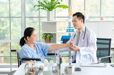 Asian male doctor in white coat with stethoscope, consulting explain medications to senior female patient professional support trust healthcare checkup, insurance treatment wellness in hospital clinic