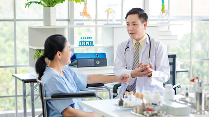 Asian male doctor in white coat with stethoscope, consulting explain medications to senior female patient professional support trust healthcare checkup, insurance treatment wellness in hospital clinic