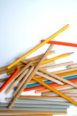 Fototapeta premium Heap of wooden pencils isolated over a white background. Copy space. Concept of Back to School