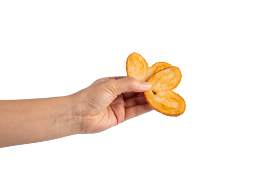 Heart shaped sugared crackers in hand on transparent background