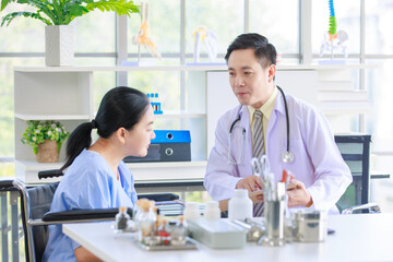 Asian male doctor in white coat with stethoscope, consulting explain medications to senior female patient professional support trust healthcare checkup, insurance treatment wellness in hospital clinic
