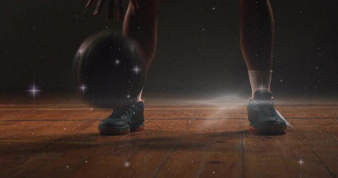 Athlete starting dribbling on ball drop keeping bounce low with soft glow and sparkles for training