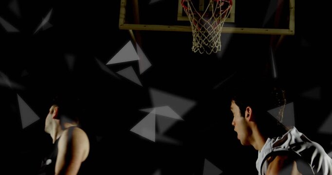 Sports pass initiating two players jumping rebound and shooting through hoop against gray triangles