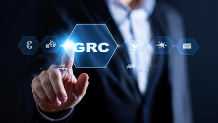 Person touching glowing blue hexagon with grc and icons business technology
