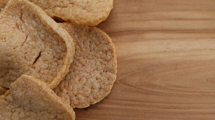 Close up jengkol crackers on wooden surface