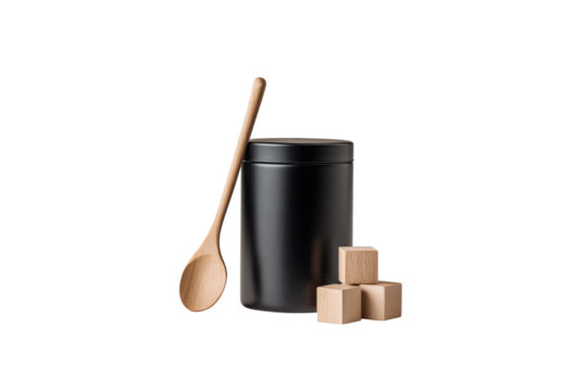 A matte black canister with wooden accents sits next to an empty spoon and some small wooden blocks. The background features a white isolated on a transparent background in PNG format. - Powered by Adobe