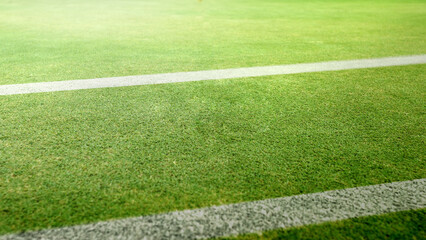 Obraz premium Yard line on the turf of an American football green field stadium