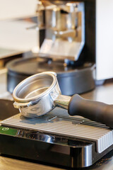Portafilter from a coffee machine in the process of making espresso