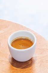 Freshly brewed espresso served in a small cup on a table