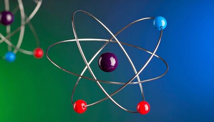 Stylized atomic structure with colorful nucleus and elliptical electron orbits.